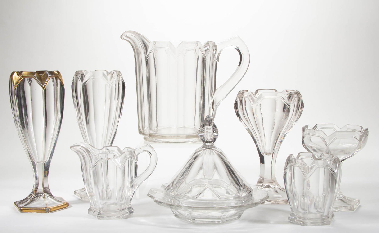FOSTORIA NO. 1630 / ALEXIS (OMN) ARTICLES, LOT OF EIGHT: FOSTORIA NO. 1630 / ALEXIS (OMN) ARTICLES, LOT OF EIGHT, colorless, comprising a water pitcher, three vases with one having gilt decoration, a covered butter dish, creamer, spooner, and jelly compote.