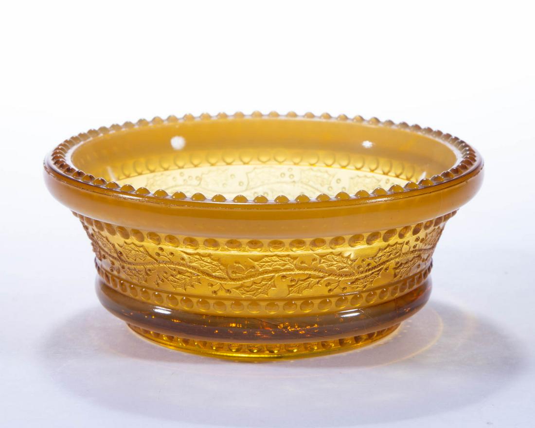 GREENTOWN NO. 450 / HOLLY AMBER SAUCE DISH: GREENTOWN NO. 450 / HOLLY AMBER SAUCE DISH, Golden Agate. Indiana Tumbler & Goblet Co. Pattern introduced 1902. 1 3/4" H, 4 1/4" D. Literature: Parallels NGGA/Measell (ed.) - Greentown Glass: A Collec