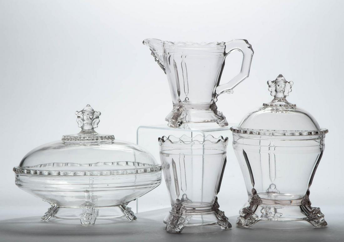 HOBBS NO. 76 / VIKING FOUR-PIECE TABLE SET: HOBBS NO. 76 / VIKING FOUR-PIECE TABLE SET, colorless, comprising a covered butter dish, covered sugar bowl, creamer, and spooner. Hobbs, Brockunier & Co. Pattern introduced 1876. 5" to 8 1/4" HOA.Lit