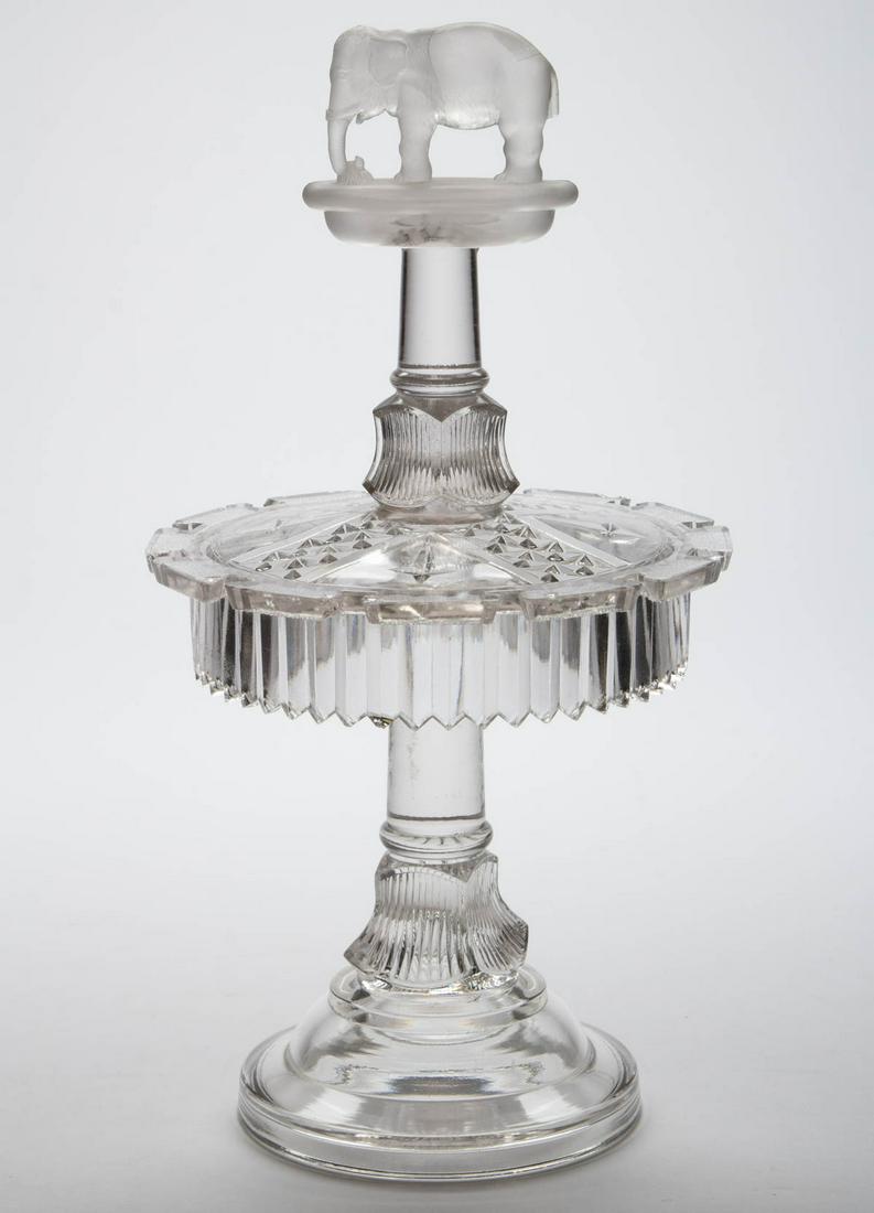 JUMBO SPOON RACK: JUMBO SPOON RACK, colorless, lightly frosted finial and ground, no patent date under base. Canton Glass Co. Circa 1884. 11 1/4" HOA. Literature: Innes - Pittsburgh Glass, p. 359, pl. 396, fig. 2. Prov
