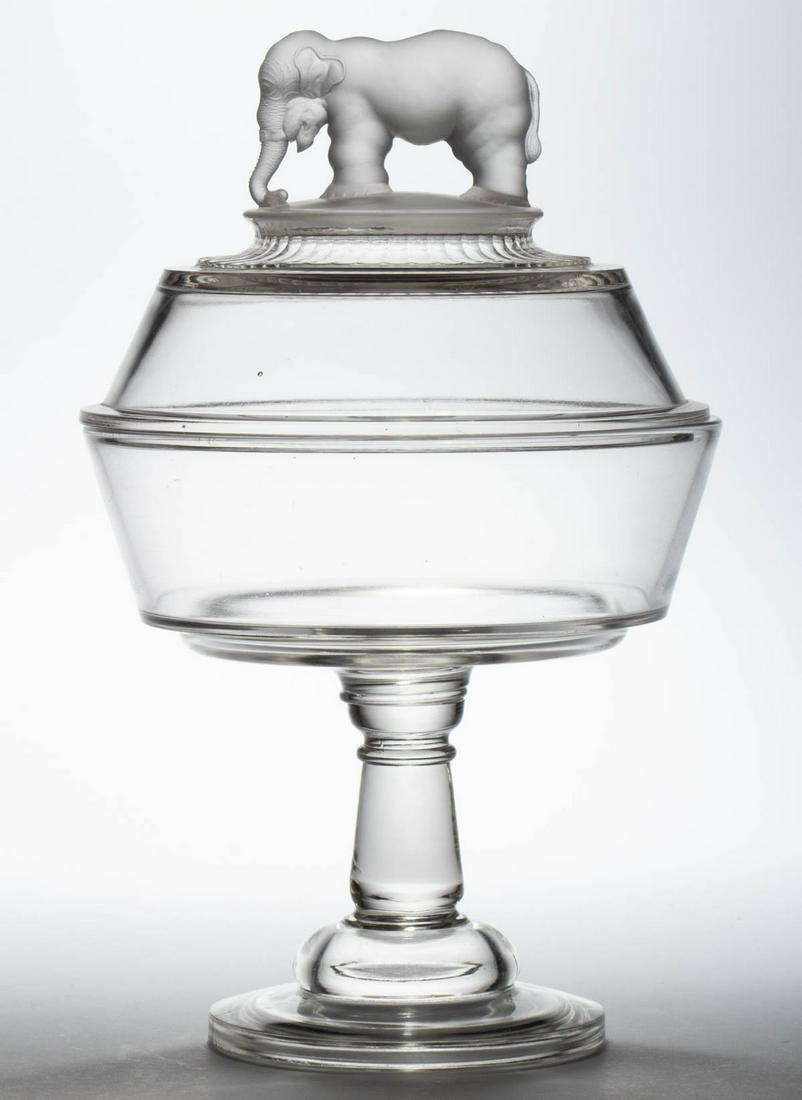 JUMBO COVERED COMPOTE: JUMBO COVERED COMPOTE, colorless, wafer construction. Canton Glass Co. Circa 1881. 13" HOA, 8" D rim. Provenance: From the Briggs - Richardson Collection, Stephens City, VA.