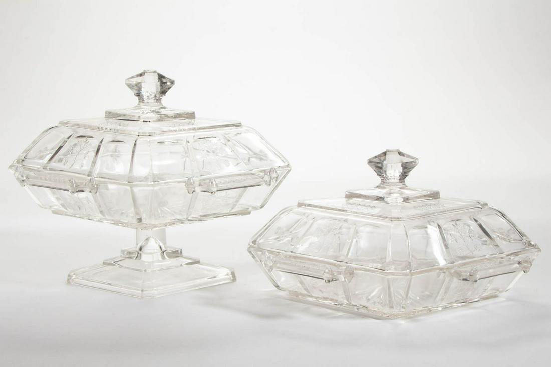 SPRIG / RIVAL (OMN) COVERED HONEY DISHES, LOT OF TWO: SPRIG / RIVAL (OMN) COVERED HONEY DISHES, LOT OF TWO, colorless, including one on foot. Bryce, Higbee & Co. Pattern introduced 1883. 4 3/4" and 6 3/4" HOA. Dishes: 6" x 8 3/4". Provenance: From a Penn