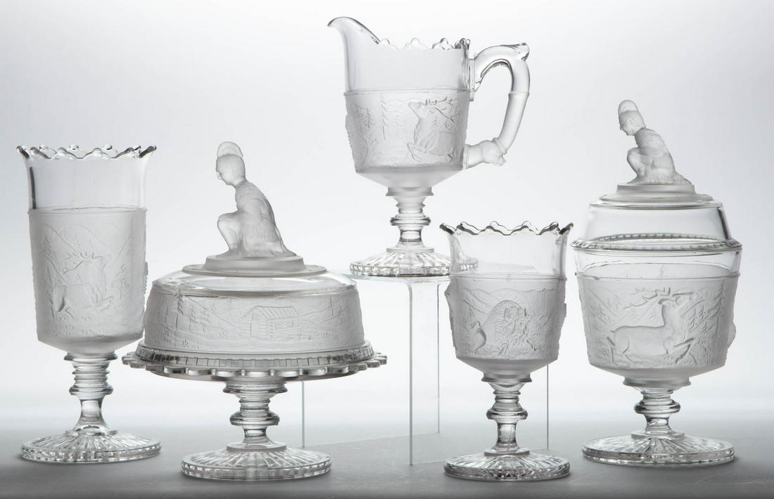 WESTWARD HO / PIONEER (OMN) FIVE PIECE TABLE SET: WESTWARD HO / PIONEER (OMN) FIVE PIECE TABLE SET, colorless and frosted, comprising a covered butter dish, covered sugar bowl, creamer, spooner, and a celery vase. Gillinder & Sons, Philadelphia, PA.