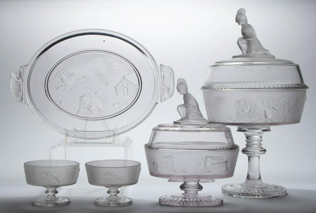 WESTWARD HO / PIONEER (OMN) TABLE ARTICLES, LOT OF FIVE: WESTWARD HO / PIONEER (OMN) TABLE ARTICLES, LOT OF FIVE, colorless and frosted, comprising a covered compote on a high standard, two sauce dishes, an oval compote, and a bread tray with deer handles. 