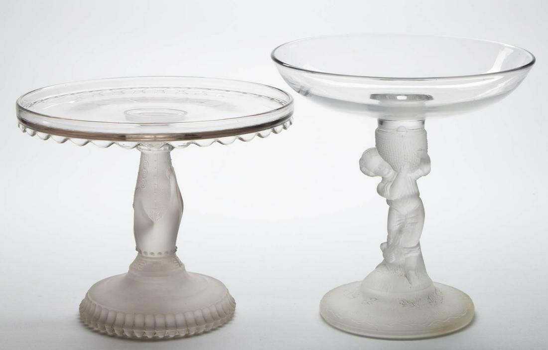 ASSORTED EAPG TABLE ARTICLES, LOT OF TWO: ASSORTED EAPG TABLE ARTICLES, LOT OF TWO, colorless and frosted, comprising a Hobbs Hand Stem cake stand, and a Goose Boy open compote. Various makers. Fourth quarter 19th century. Hand: 7 3/8" H, 9" 
