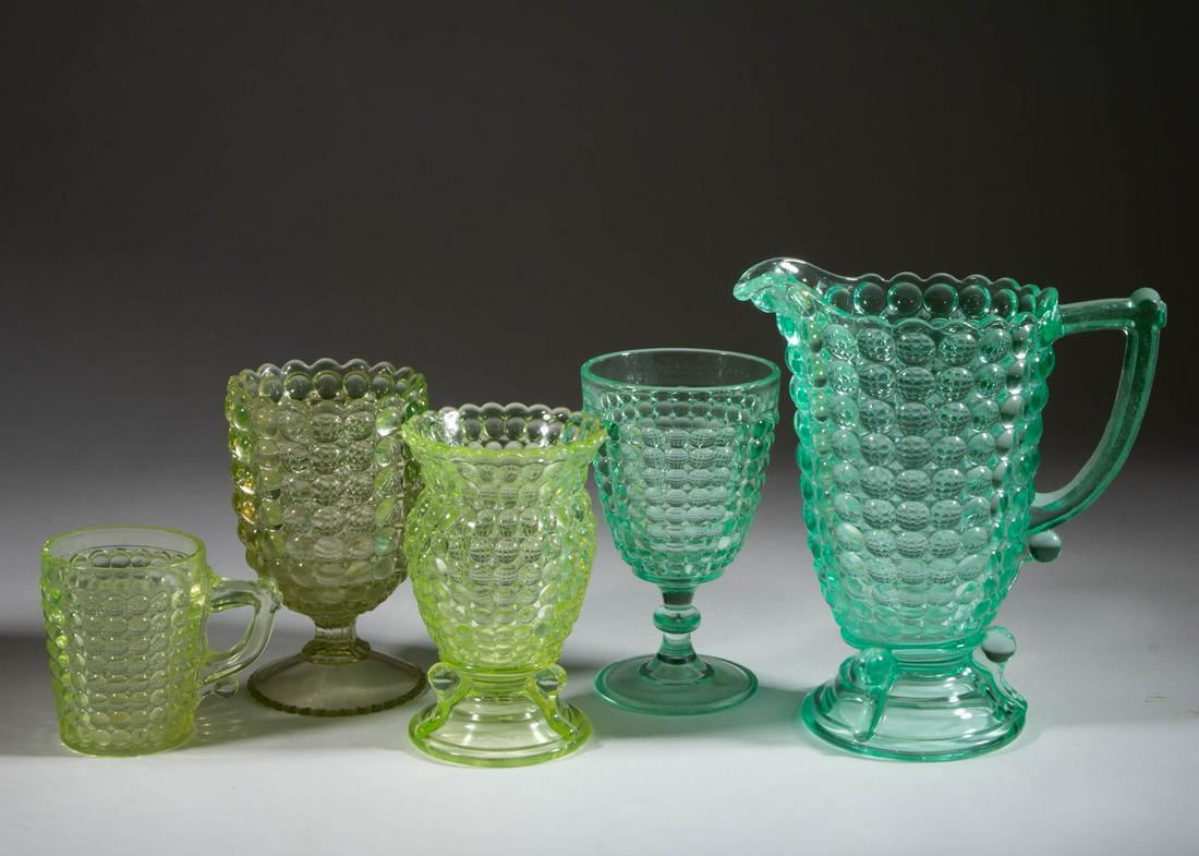 ASSORTED THOUSAND EYE GLASS ARTICLES, LOT OF FIVE: ASSORTED THOUSAND EYE GLASS ARTICLES, LOT OF FIVE, Vaseline and apple green (each reacts under black light), comprising an Adams milk pitcher, goblet, spooner, and mug, and a Richards & Hartley spoone