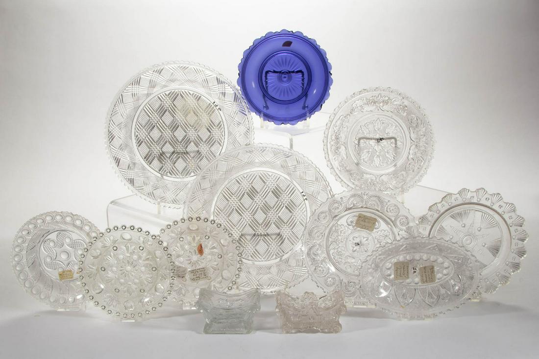 ASSORTED PRESSED LACY GLASS ARTICLES, LOT OF 12: ASSORTED PRESSED LACY GLASS ARTICLES, LOT OF 12, colorless and amethyst, including a Gothic Arch covered sugar bowl, an Oak Leaf plate, a Gothic Arch oval bowl, and a two checkered plates. Various mak