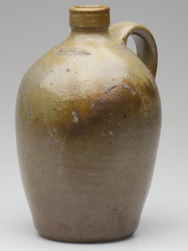 STAMPED "JOHN BELL / WAYNESBORO", PA STONEWARE JUG: STAMPED "JOHN BELL / WAYNESBORO", PA STONEWARE JUG, approximately 1/2 gallon, salt glazed, tall mouth, lower edge of mark partially obscured by stacker scar. Second half 19th century. 9 1/4" h.
