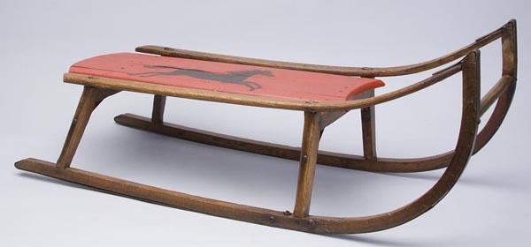HICKORY AND POPLAR CHILD'S SLED: HICKORY AND POPLAR CHILD'S SLED, mortised and nailed construction, seat repainted and restenciled. Fourth quarter 19th century. 7" h seat, 31" long.