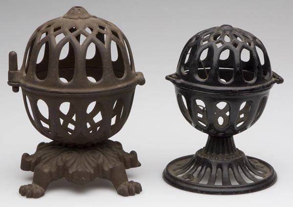 TWO CAST-IRON COUNTRY STORE STRING HOLDERS: TWO CAST-IRON COUNTRY STORE STRING HOLDERS, each raised on a bolted base with patent information underneath, small example with original black paint. Second half 19th century. 5 3/4" and 6 1/2" h. Pro