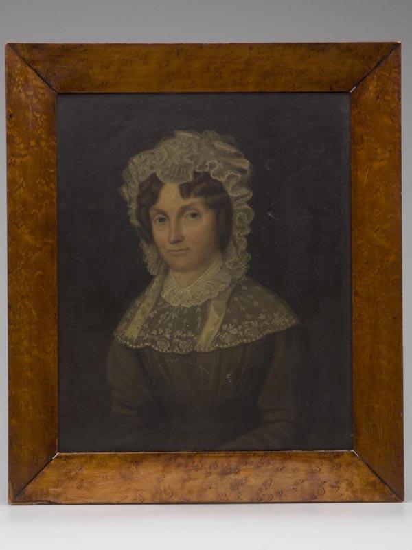 AMERICAN OR BRITISH SCHOOL PORTRAIT: AMERICAN OR BRITISH SCHOOL PORTRAIT, oil on board, depicting a young lady wearing a lace bonnet and capelet, no signature located, period bird's-eye maple frame. Mid 19th century. 12" x 10" sight, 15
