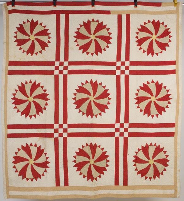 VIRGINIA PIECED PINWHEEL DESIGN QUILT: VIRGINIA PIECED PINWHEEL DESIGN QUILT, nine blocks divided by double-bar sashing, simple line quilting. Late 19th/early 20th century. 78" x 84". Provenance: Found in Wythe Co., VA.