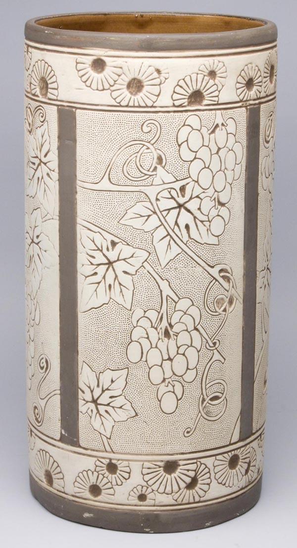 AMERICAN ART POTTERY WELLER BURNTWOOD UMBRELLA STA: AMERICAN ART POTTERY WELLER BURNTWOOD UMBRELLA STAND, displaying four panels featuring grape vine designs, not signed. First half 20th century. 20" h, 10" dia.