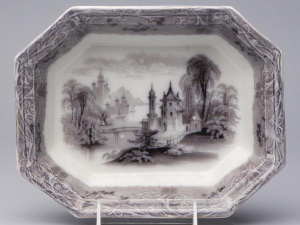 STAFFORDSHIRE TRANSFERWARE SERVING BOWL: STAFFORDSHIRE TRANSFERWARE SERVING BOWL, mulberry, octagonal form with under glaze mark for "Rhone Scenery" by T. J. & J. Mayer. Mid 19th century. 2 1/4" h, 8 1/8" x 10 1/4". Provenance: From the Coll