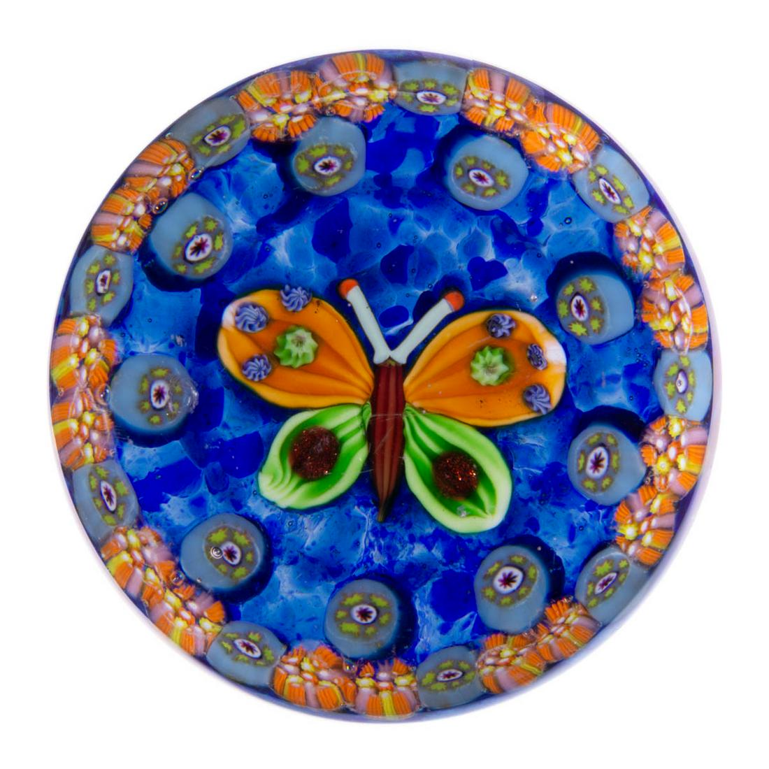 EARLY PAUL YSART (SCOTTISH, 1904-1979) ATTRIBUTED: EARLY PAUL YSART (SCOTTISH, 1904-1979) ATTRIBUTED BUTTERFLY LAMPWORK AND MILLEFIORI ART GLASS PAPERWEIGHT, encasement having a grey tint, central butterfly with a plum body, butterscotch and green win