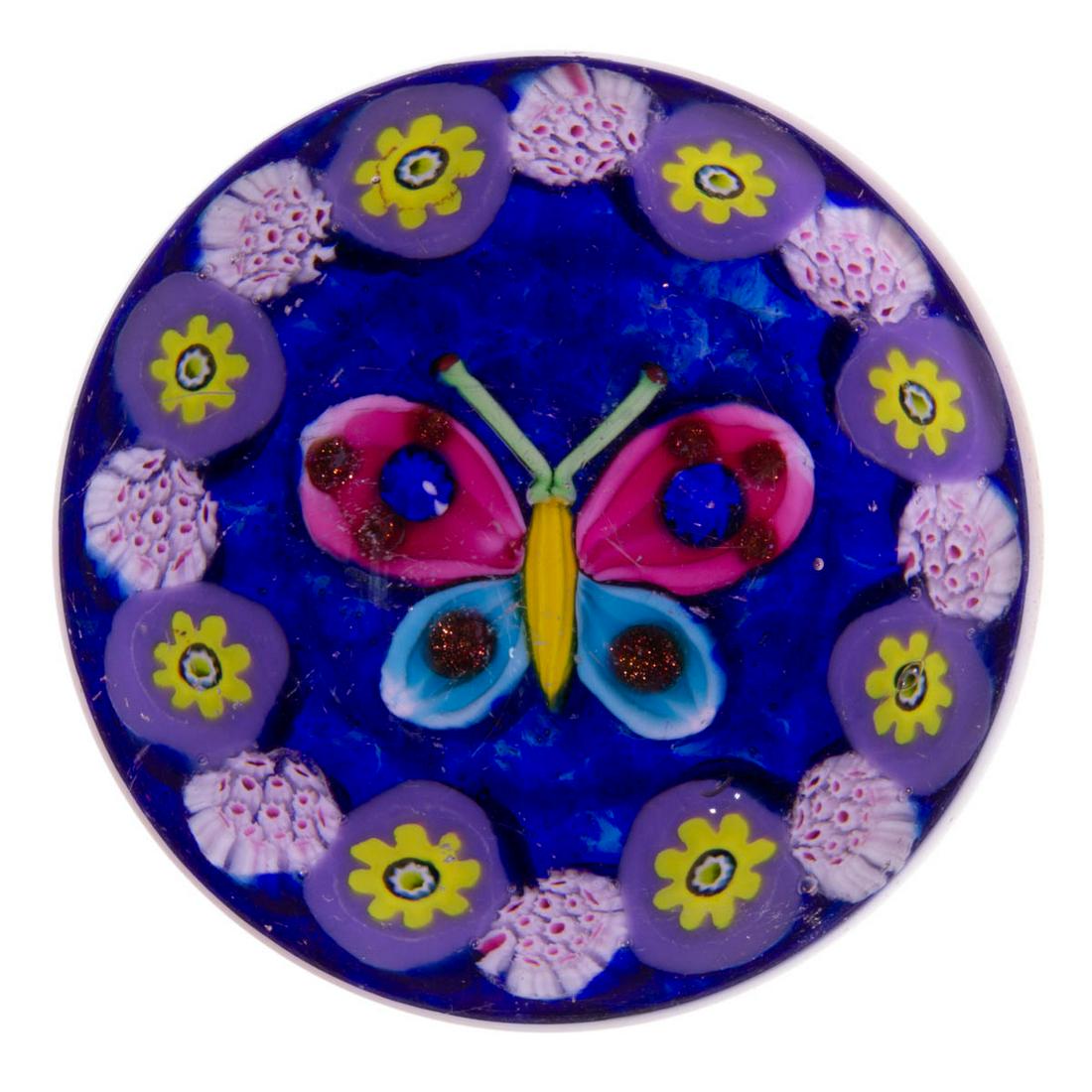EARLY PAUL YSART (SCOTTISH, 1904-1979) ATTRIBUTED: EARLY PAUL YSART (SCOTTISH, 1904-1979) ATTRIBUTED BUTTERFLY LAMPWORK AND MILLEFIORI ART GLASS PAPERWEIGHT, encasement having a purple tint, central butterfly with a yellow body, cranberry and blue win