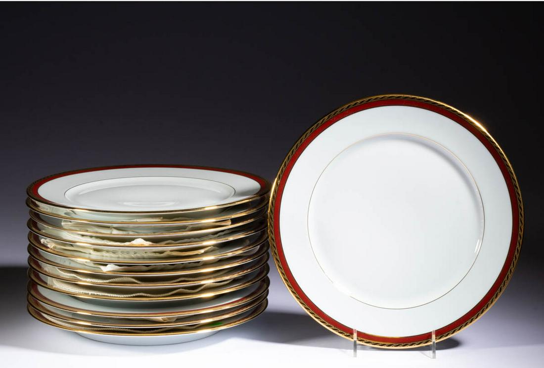 FRENCH LIMOGES FOR TIFFANY & CO. BRIQUE BAND PORCELAIN: FRENCH LIMOGES FOR TIFFANY & CO. BRIQUE BAND PORCELAIN PLATES, SET OF 12, each having rust-colored band with gilt scrolled band decoration. Each having green-printed crown with "C / LIMOGES / FRANCE" 