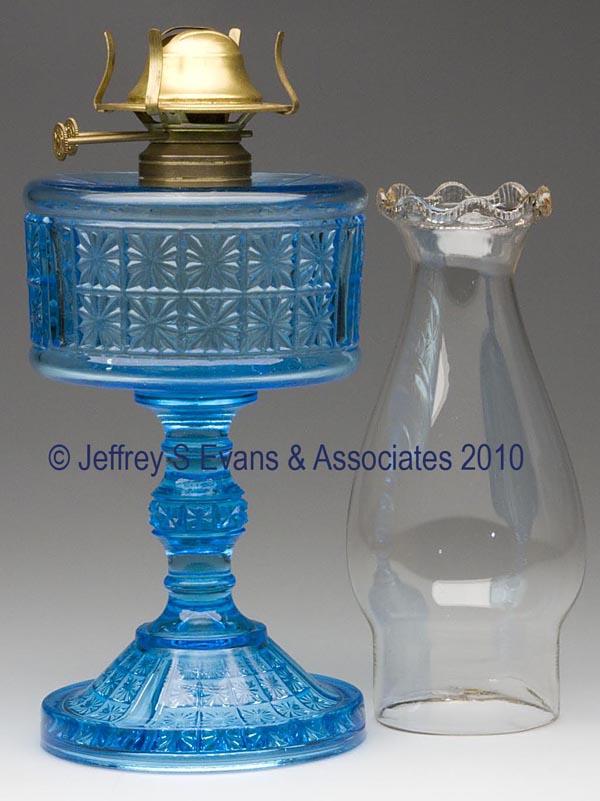 THREE PANELED TWO PANEL STAND LAMP: THREE PANELED TWO PANEL STAND LAMP, blue, No. 2 Taplin-Brown collar, non-period slip burner with double wicks and thumbwheels stamped "V. M. PATENADO", period chimney with serrated scallop top. Richar
