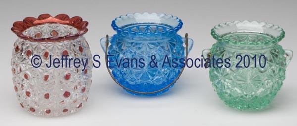 VARIOUS DAISY AND BUTTON PATTERNS MATCH HOLDERS, L: VARIOUS DAISY AND BUTTON PATTERNS MATCH HOLDERS, LOT OF THREE, kettle forms, consisting of a blue and green, including one with a bail handle, and a ruby stained with flared rim. 2 1/2" to 2 5/8" h ov