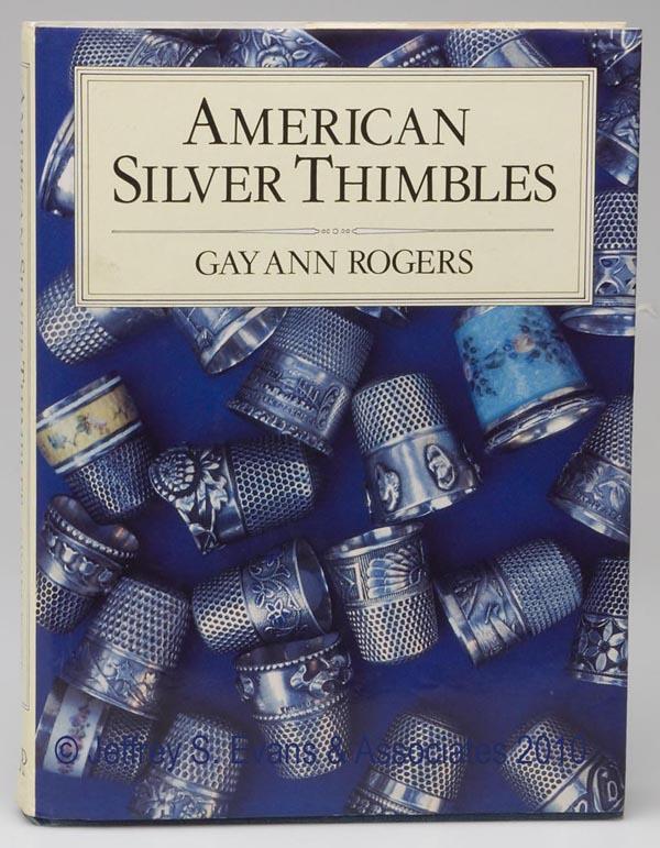 THIMBLE REFERENCE VOLUME: THIMBLE REFERENCE VOLUME, "American Silver Thimbles", with "Price Guide" booklet, by Gay Ann Rogers, Claremont, CA; Needlework Unlimited, 1989, first printing, hard cover with dust jacket, signed by a