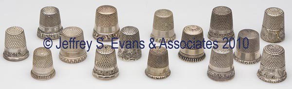KETCHAM & MCDOUGALL STERLING SILVER THIMBLES, LOT O: KETCHAM & MCDOUGALL STERLING SILVER THIMBLES, LOT OF 15, consisting of three with chased scroll bands, others with various patterns to bands and rim edges. Each marked in apex, four with monogram. Lat