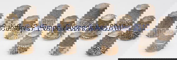 SIMONS BROTHERS STERLING SILVER WITH GOLD BAND THIM: SIMONS BROTHERS STERLING SILVER WITH GOLD BAND THIMBLES, LOT OF 13, chased, engraved and rolled with various scroll and geometrical patterns, including two fluted, a Scrolling Acanthus, a plain band,