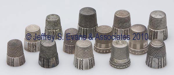 SIMONS BROTHERS STERLING SILVER PATENT-DATED THIMBL: SIMONS BROTHERS STERLING SILVER PATENT-DATED THIMBLES, LOT OF 13, consisting of ten with paneled bands, impressed "PAT. MAY 28. 89"; and three Priscilla impressed "PAT. MAY 31 98". Each with maker's m