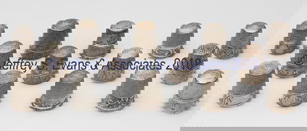 SIMONS BROTHERS STERLING SILVER THIMBLES, LOT OF 14: SIMONS BROTHERS STERLING SILVER THIMBLES, LOT OF 14, various chased, engraved, and rolled floral and geometrical patterns, including a Walls of Troy/Greek Key, and one example with worn "SOUVENIR". Ea