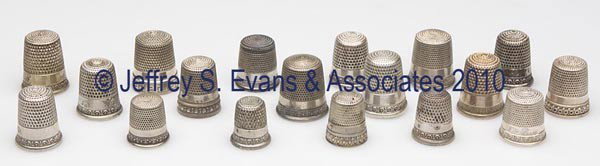SIMONS BROTHERS STERLING SILVER DOUBLE-BAND THIMBLE: SIMONS BROTHERS STERLING SILVER DOUBLE-BAND THIMBLES, LOT OF 18, consisting of eight Wave Scroll; two Walls of Troy/Greek Key; two Fleur-de-lis; an egg and dart pattern; and five others. Each with mak