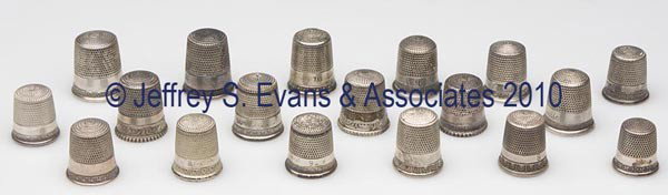 SIMONS BROTHERS STERLING SILVER UTILITARIAN THIMBLE: SIMONS BROTHERS STERLING SILVER UTILITARIAN THIMBLES, LOT OF 18, consisting of three Light Bead Rim examples; four egg and dart pattern; three with Anthemion pattern; and eight others. Each with maker