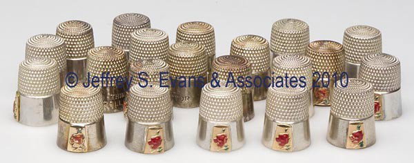 SIMONS BROTHERS STERLING SILVER THIMBLES, LOT OF 2: SIMONS BROTHERS STERLING SILVER THIMBLES, LOT OF 21, each with plain band impressed "THIMBLE COLLECTOR", and with an applied gold washed thimble with enameled flower, each with maker's mark in apex. N