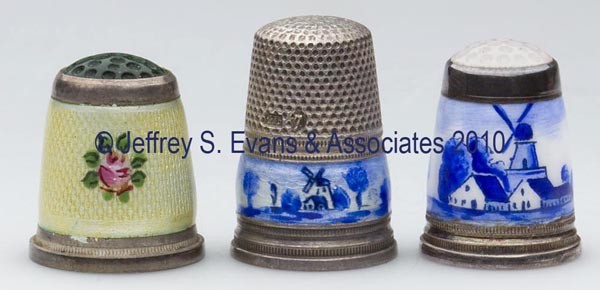 GERMAN ENAMEL ON STERLING SILVER THIMBLES, LOT OF : GERMAN ENAMEL ON STERLING SILVER THIMBLES, LOT OF THREE, consisting of two with blue and white Delft decoration, including a Gabler and a moonstone colored stone cap; and an example with yellow ground