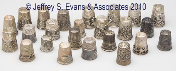 GERMAN AND PORTUGESE STERLING SILVER THIMBLE: GERMAN AND PORTUGESE STERLING SILVER THIMBLES, LOT OF 24, various patterns, including two embroidery, eleven with German star on cap, including three Helmut Grief examples, one with monogram. 20th cen