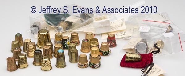 BRASS AND VARIOUS METALS THIMBLES, LOT OF 36: BRASS AND VARIOUS METALS THIMBLES, LOT OF 36, including ten Austrian with petit-point bands; seven with colored stone caps; two quilter's thimbles; a stone cap ring handcrafted from a thimble; and 16 