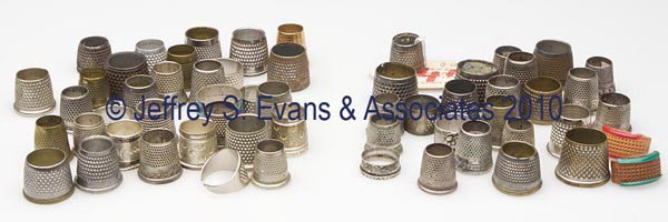 TAILOR'S AND RING-TYPE VARIOUS METALS THIMBLES, LO: TAILOR'S AND RING-TYPE VARIOUS METALS THIMBLES, LOT OF 55, including four sterling silver and one marked "COIN". Together with two leather and a thimble rim. Fifty-eight (58) pieces total. Late 19th t