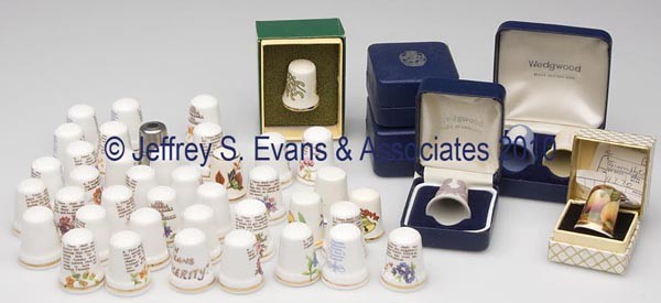 ENGLISH CERAMIC AND PEWTER THIMBLES, LOT OF 46: ENGLISH CERAMIC AND PEWTER THIMBLES, LOT OF 46, consisting of 34 Mount Royal China Co. fine bone china marked "The Thimble Collectors Ten Commandments"; five Wedgwood examples with various relief mold