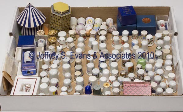 CERAMIC / PORCELAIN THIMBLES, LOT OF 140: CERAMIC / PORCELAIN THIMBLES, LOT OF 140, various souvenir, floral, and figural patterns, one example with a chain. 20th century. Various sizes. Provenance: Collection of the late Fern I. Hill.