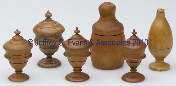 TURNED WOOD THIMBLE CASES, LOT OF SIX: TURNED WOOD THIMBLE CASES, LOT OF SIX, five examples with pedestal foot and including one with an impressed "V" to underside of foot. Late 19th/early 20th century. 2 1/4" to 2 3/4" h overall. Provenan