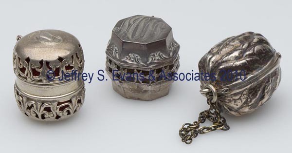 FOSTER & BAILEY STERLING SILVER SEWING CONTAINERS,: FOSTER & BAILEY STERLING SILVER SEWING CONTAINERS, LOT OF THREE, each with chatelaine hook and hinged lid, consisting of two thimble cases including a butternut-form and an octagonal form; and an emer