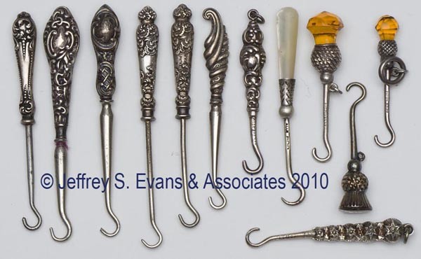 STERLING SILVER HANDLE BUTTON HOOKS, LOT OF 12: STERLING SILVER HANDLE BUTTON HOOKS, LOT OF 12, various scrollwork and floral embossing, consisting of three Foster & Bailey; three Crisford & Norris thistle forms with two having amber stones; two Ad