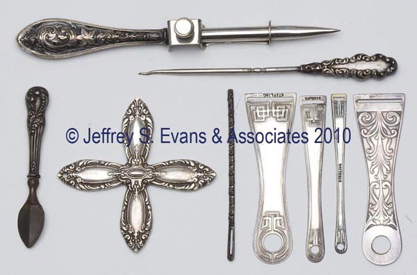 STERLING SILVER NEEDLEWORKING TOOLS, LOT OF NINE: STERLING SILVER NEEDLEWORKING TOOLS, LOT OF NINE, consisting of five bodkins, two stilettos, a Towle silk winder with hole for hanging, and a manicure tool. Late 19th/early 20th century. 2 1/2" to 5" 