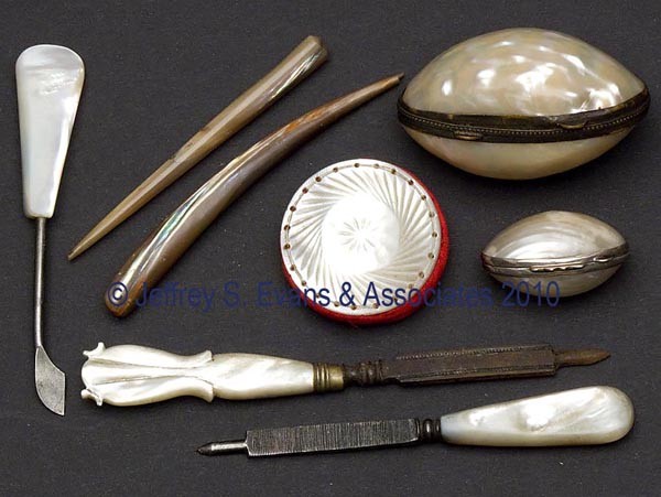 MOTHER-OF-PEARL SEWING ARTICLES, LOT OF EIGHT: MOTHER-OF-PEARL SEWING ARTICLES, LOT OF EIGHT, consisting of two files; two thimble containers, smallest example marked "Italy 925"; two stilettos; a disk-form pin cushion; and a button remover. Mid t
