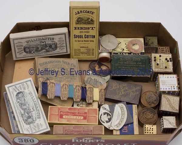 PIN AND SPOOL CARDBOARD BOXES AND HOLDERS, LOT OF : PIN AND SPOOL CARDBOARD BOXES AND HOLDERS, LOT OF 30, consisting of nine cubes and disks for toilet pins, five advertisement pin cushions, four pin boxes, and 12 spool boxes and holders. Late 19th and