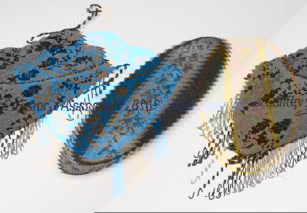 TWO VICTORIAN BEADED ARTICLES: TWO VICTORIAN BEADED ARTICLES, comprised of a wall pocket with cord edging and fringe, and an oval box with fabric interior. Fourth quarter 19th to early 20th century. Box 8" x 12". Provenance: Hilda