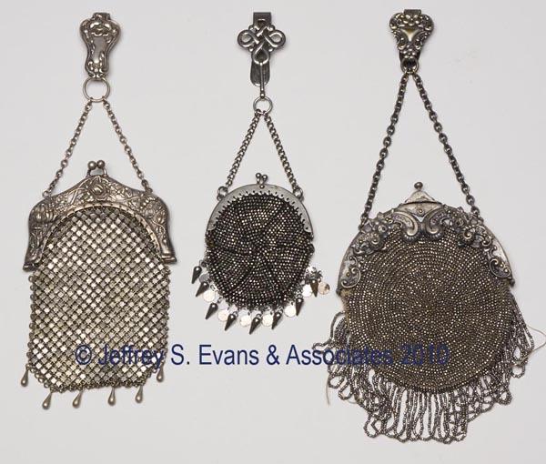THREE ASSORTED LADY'S PURSES: THREE ASSORTED LADY'S PURSES, comprised of a marked German Silver mesh example with repousse decoration and matching chatelaine clip, along with two metallic bead examples with metal frames and matchi