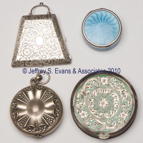 FOUR STERLING SILVER LADY'S COMPACTS: FOUR STERLING SILVER LADY'S COMPACTS, each marked, blue enameled example also marked Germany, three with interior mirror. First half 20th century. Smallest 1 1/4" dia. Provenance: Hilda Fried estate, 