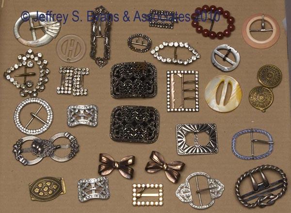 ASSORTED LOT OF VINTAGE COSTUME BUCKLES: ASSORTED LOT OF VINTAGE COSTUME BUCKLES, 28 pieces, mostly one-piece, including cut steel, glass, rhinestone, plastic, metal, etc. 19th and 20th centuries. Various sizes. Provenance: Hilda Fried estat
