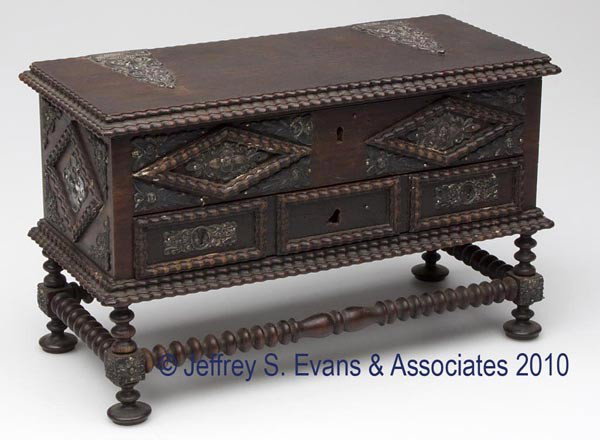 SILVER-MOUNTED ROSEWOOD JEWELRY CHEST: SILVER-MOUNTED ROSEWOOD JEWELRY CHEST, hinged top concealing a fabric-lined interior, above a single drawer, applied ripple moldings and ornaments, raised on spool-turned legs joined by a box stretche