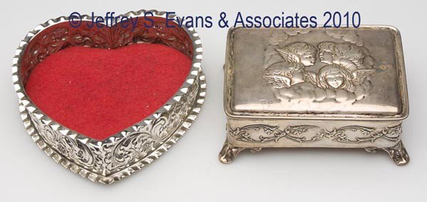 TWO SILVER DRESSER BOXES: TWO SILVER DRESSER BOXES, comprised of a covered example with embossed cherubs on lid, hallmarked for Birmingham, England, and an open heart-form example marked sterling and for Black, Starr & Frost. 