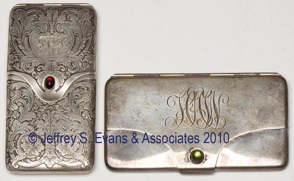 TWO STERLING SILVER HINGED-FLAP CALLING CARD CASES: TWO STERLING SILVER HINGED-FLAP CALLING CARD CASES, comprised of an elaborately engraved Reed and Barton example and a Watson Co. example, each with a cabochon jewel clasp, gilt interior, and monogram